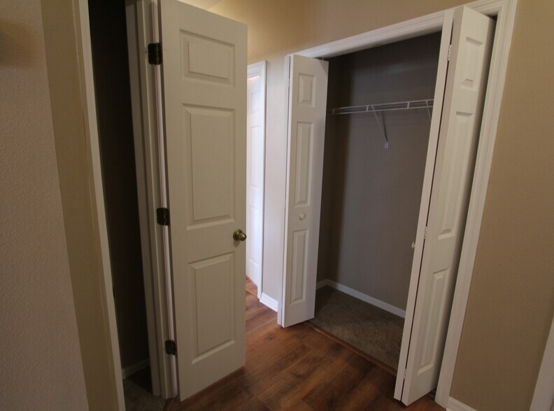 Linen closet and double door coat closet in hallway - 37410 Picketts Mill Ave