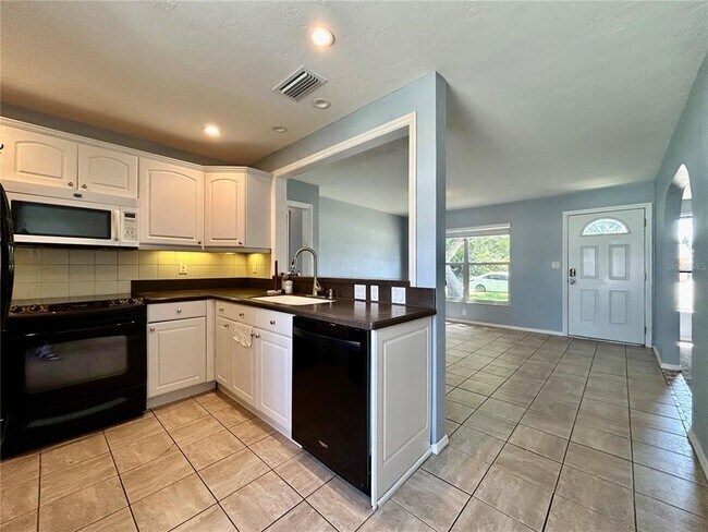 Building Photo - 6821 Onyx Dr N