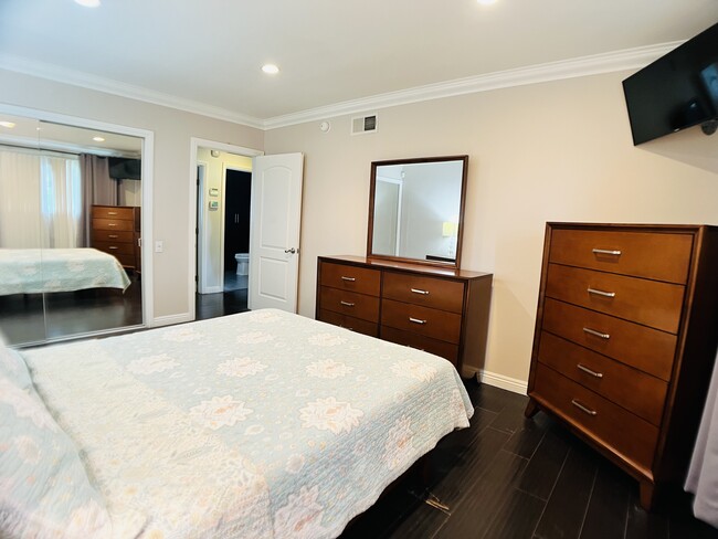 Master bedroom with mounted TV - 6301 Coldwater Canyon Ave