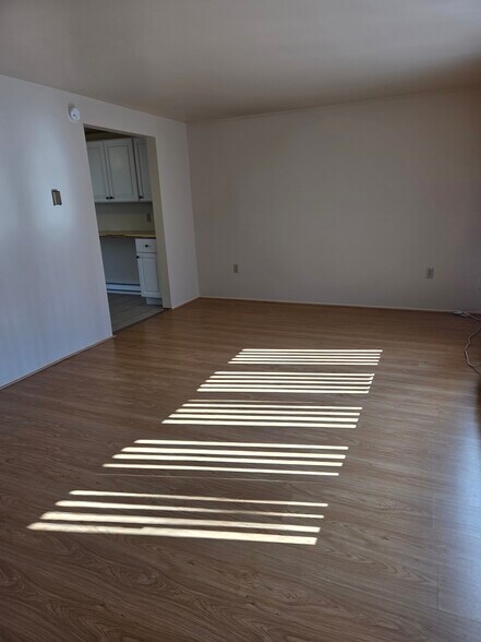 Sun streaking through the bay window in the living room - 496 Mercer Rd