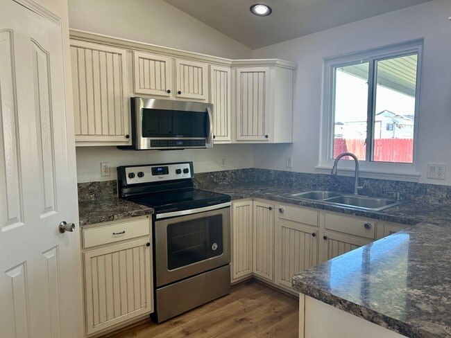 Building Photo - Spacious 4-Bedroom Home with RV Parking & No Backyard Neighbors