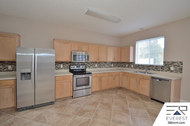 Building Photo - SPACIOUS, FULLY FENCED 4/2.5/2 IN DESIRABLE MATANZAS WOODS