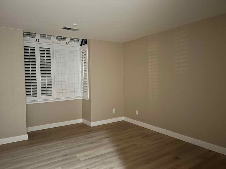 Bay window with plantation shutters in the bedroom - 3183 Wayside Plz