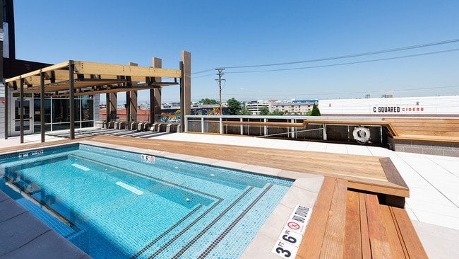 Year-round pool deck with spa, cabanas, and heated areas - Modera River North