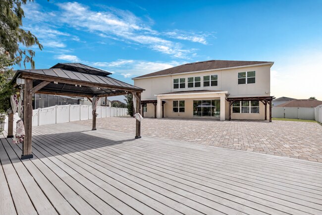 Building Photo - Spacious 6-Bedroom Home Near Lake Nona | 3-Car Garage + Tesla Charger