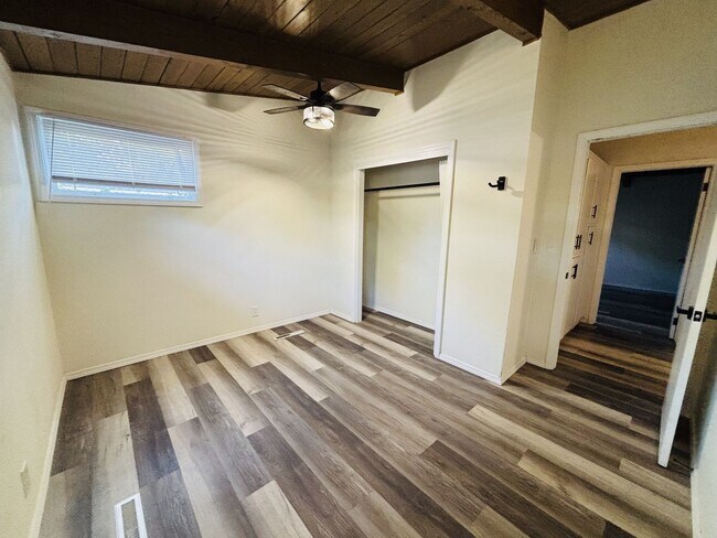 Building Photo - Quirky Mid-Century 3BR with High Beam Ceilings + Fenced Yard – $1,550