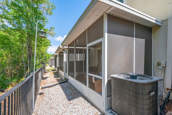 Building Photo - Furnished Townhome with Conservation View in The Bay at Cypress Creek!