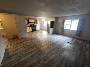 Building Photo - Freshly painted spacious 2-bedroom 1-bath home with a screened porch and storage shed.