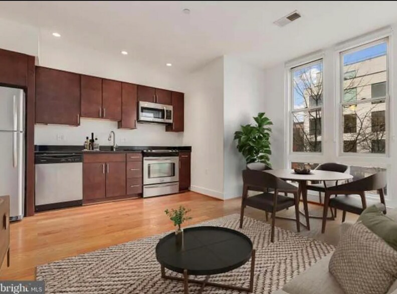 The open concept provides an easy and airy flow to the condo. - 2910 Georgia Ave NW