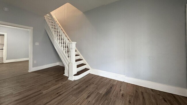 Building Photo - Updated 3 Bedroom 1.5 Bath Townhome w/ Paved Yard + Washer & Dryer