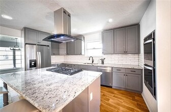 Building Photo - Newly Renovated 4-bedroom Home Inside the ...