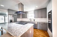 Building Photo - Newly Renovated 4-bedroom Home Inside the ...