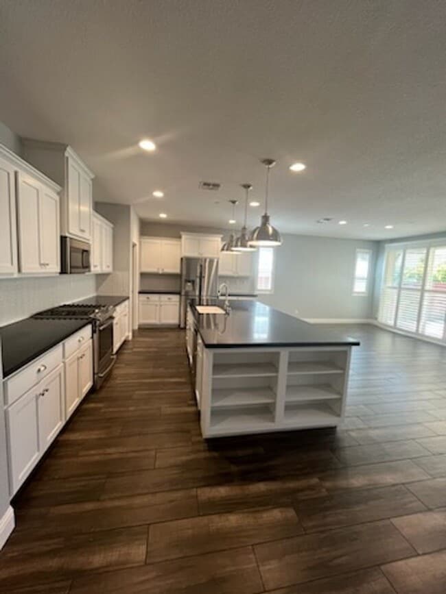 Building Photo - Solar powered open concept home located in...
