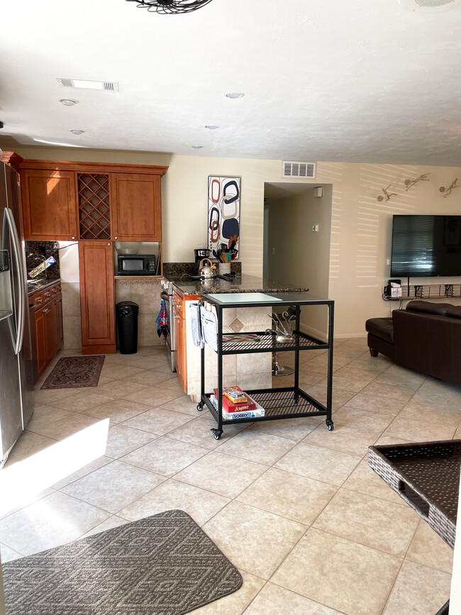 KITCHEN The kitchen is equipped with stainless steel appliances, cooking essentials, & drip coffee - 465 8th St N