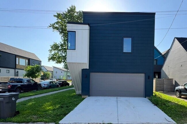 Building Photo - Vaulted Ceilings & Hardwood Floors in This Charming Indianapolis L