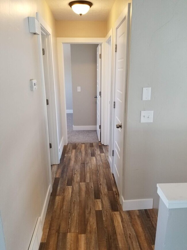 Building Photo - Spacious 5-Bedroom Magna Home with Deck and Ample Parking