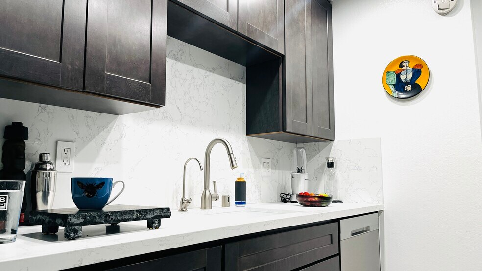 New kitchen With stainless steel refrigerator, dishwasher, microwave, and stove. Garbage disposal - 6600 Warner Ave