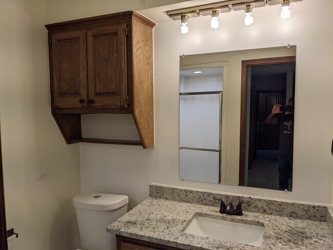 Master bath with New granite countertops, toilet - 1618 Julie Plz