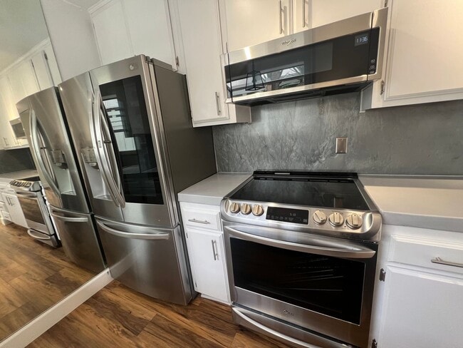 Building Photo - TWO PARKING SPACES INCLUDED! In Unit Washer & Dryer! Large Private Patio for Bikes, Boards and Bb...