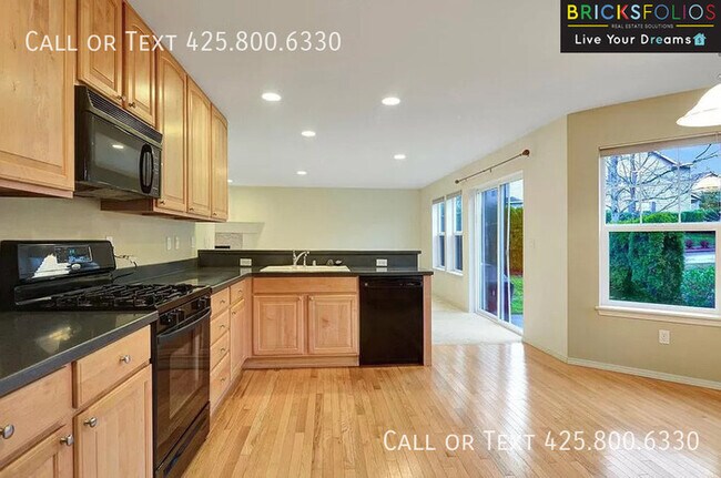 Building Photo - Dream Kitchen, Dual Fireplaces: Find Your Stylish Sanctuary in Redmond Ridge.