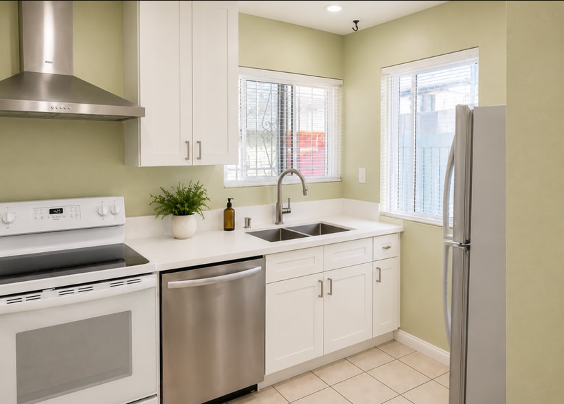 BRAND NEW REMODELED Kitchen: New countertops, cabinets, sink, faucet, blinds and appliances - 4425 Kansas St
