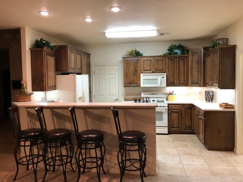Kitchen and dining area - 1806 N Dixie Downs Rd