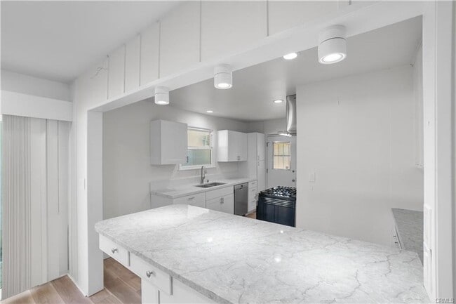 Building Photo - Welcome to this inviting 3 bedroom, 2 bath residence tucked away on a peaceful street in the hear...