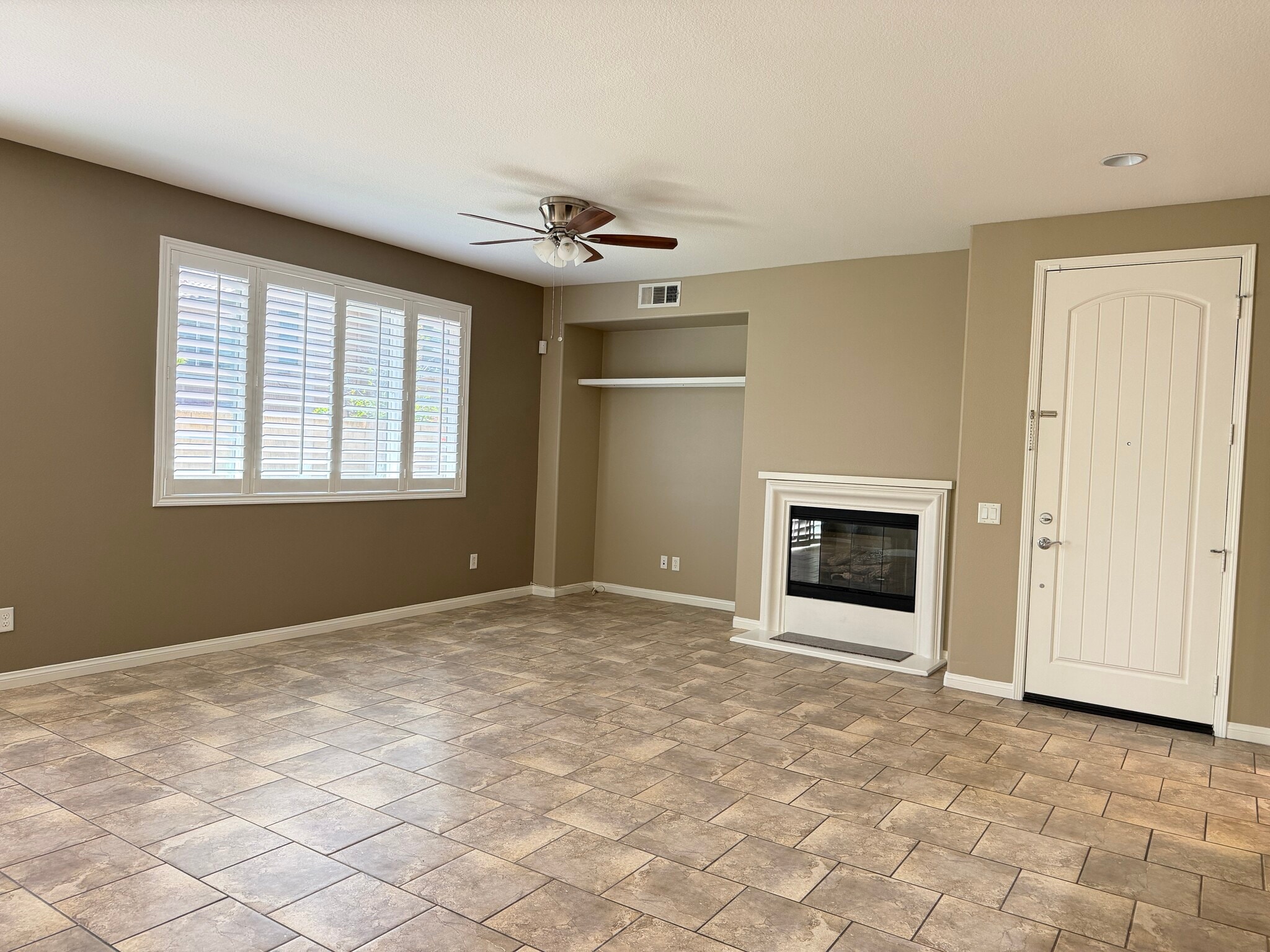 Living room with Plantation shutters - 28377 Mirabelle Ln