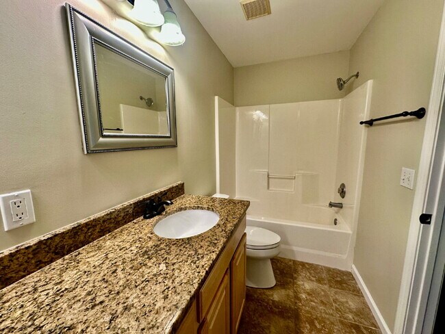 Building Photo - Four Bedroom Home with Private Fenced Back Yard in the Farm!