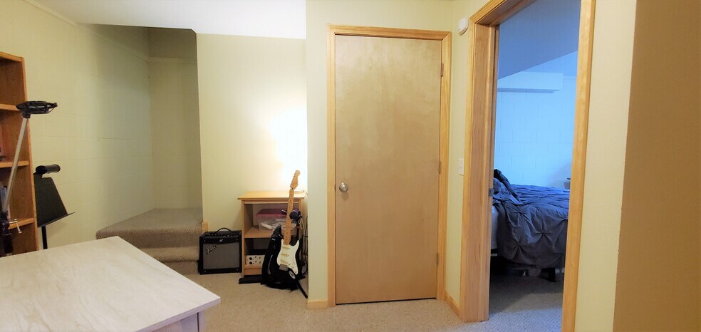 Lower level common area. (photo from neighboring unit with the same layout) - 1756 St Joseph St