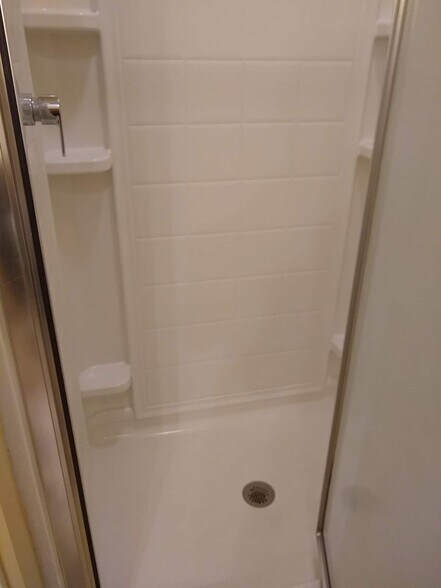 Shower has plenty of shelves for your bath goodies - 156 Henry St