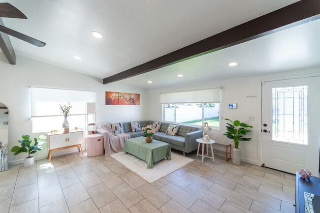 Living room bathed in natural light, creating a warm and inviting atmosphere! - 9853 Saint George St