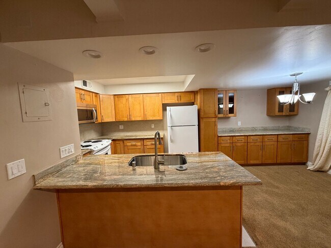 Building Photo - UNFURNISHED Upgraded Condo in Quiet Condominium Complex- New Flooring Coming Soon!