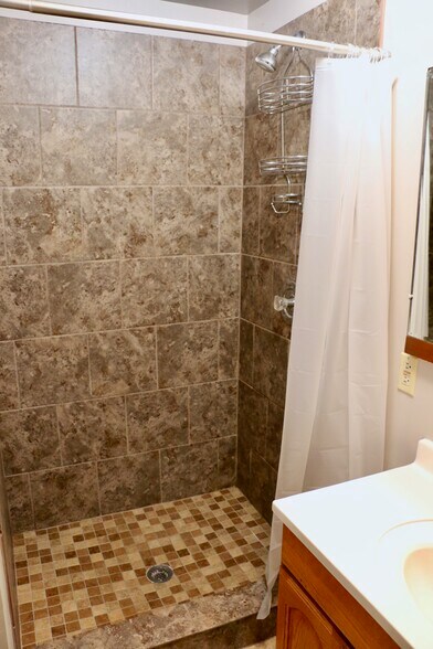 Main Level Bathroom with Tiled Shower - 429 Warren St