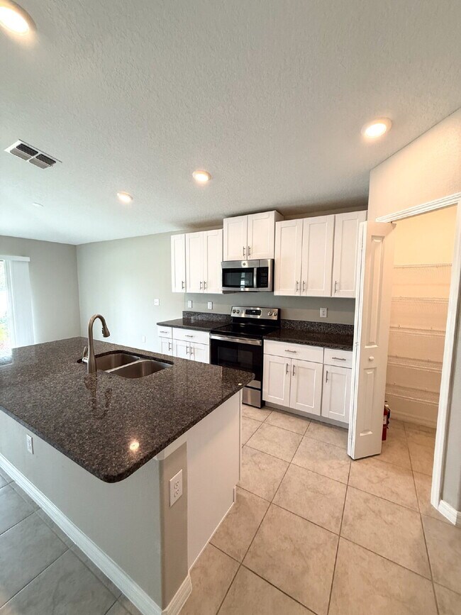Building Photo - LIKE NEW 4-Bedroom, 2 Bath home in Triple ...