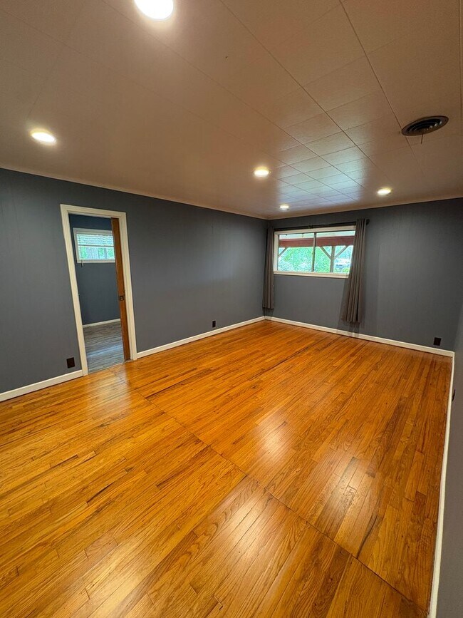 Building Photo - Storybook Cedar Home Down a Private Tree-Lined Drive