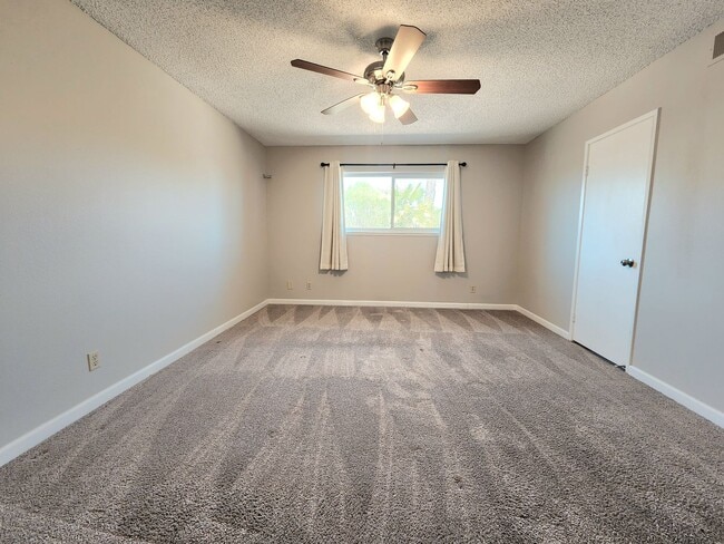 Building Photo - 4 Bedroom Two-Story Home with Downstairs Primary Bedroom & Fireplace