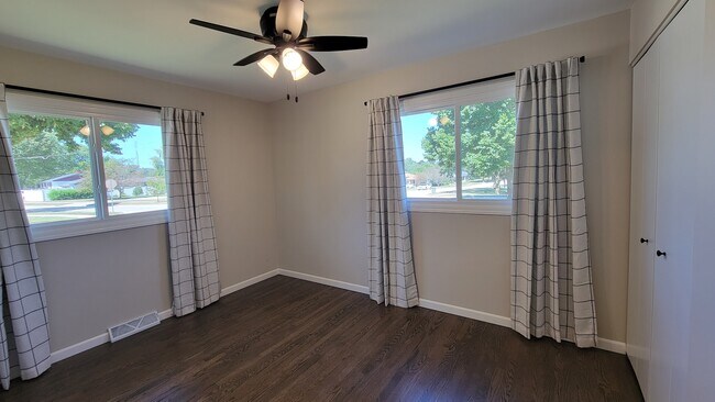 Bedroom 2. Refinished hardwood floors, 4 ft wide closet, new windows and ceiling fan. - 6305 49th Ave
