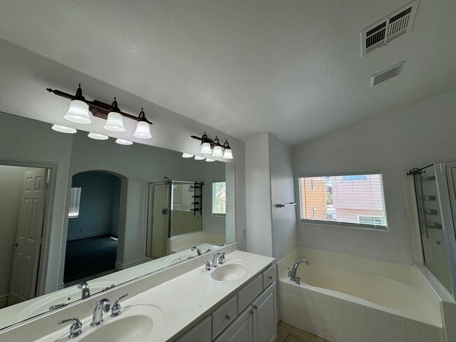Building Photo - STUNNING 2 STORY HOME IN A GUARD GATED COM...