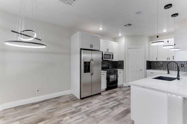 Building Photo - Modern Two-Story Home with Stylish Kitchen...