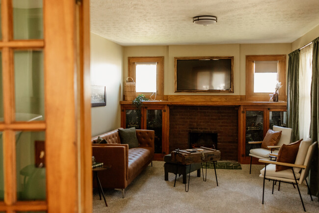 spacious living room antique wood built ins - 1203 E Edwards Ave