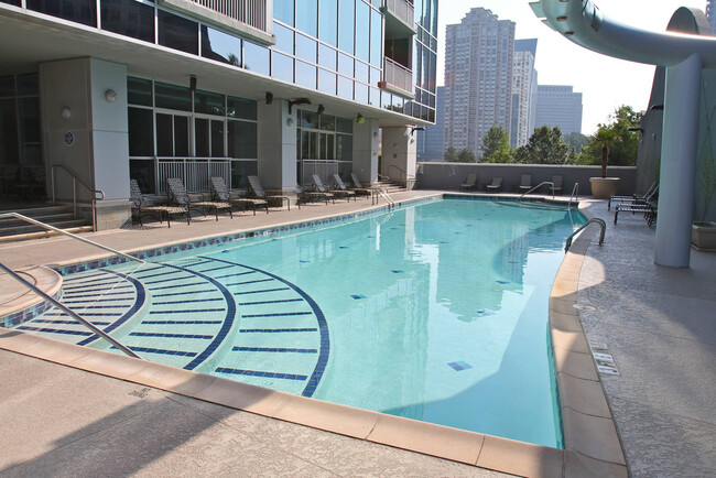 Pool area with waterfall, towel service, pool bar on weekends, grilling area - 3338 Peachtree Rd NE