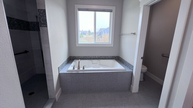 Building Photo - NEW LISTING! Latah Valley 3 bed/2 bath mus...