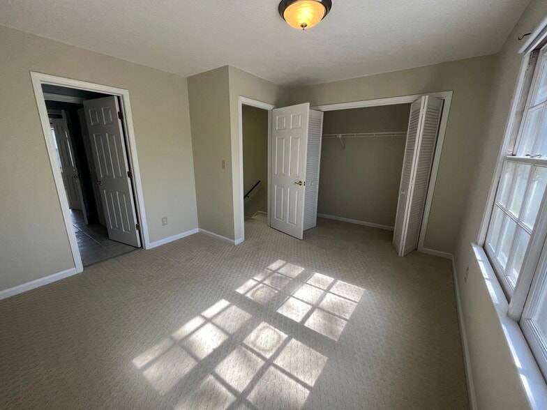 Second bedroom with great natural light and large closet space connected to the half bath - 830 44th Ave N