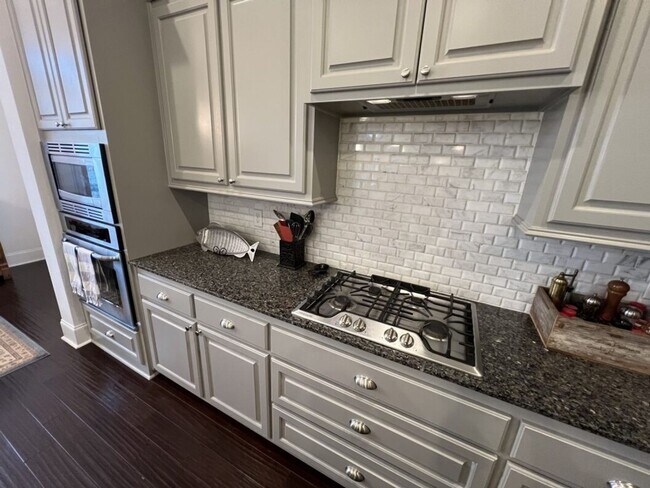 Building Photo - Luxury 4BR Home in Americana | 11 Ft Ceilings, Courtyard Living & Furnished Option