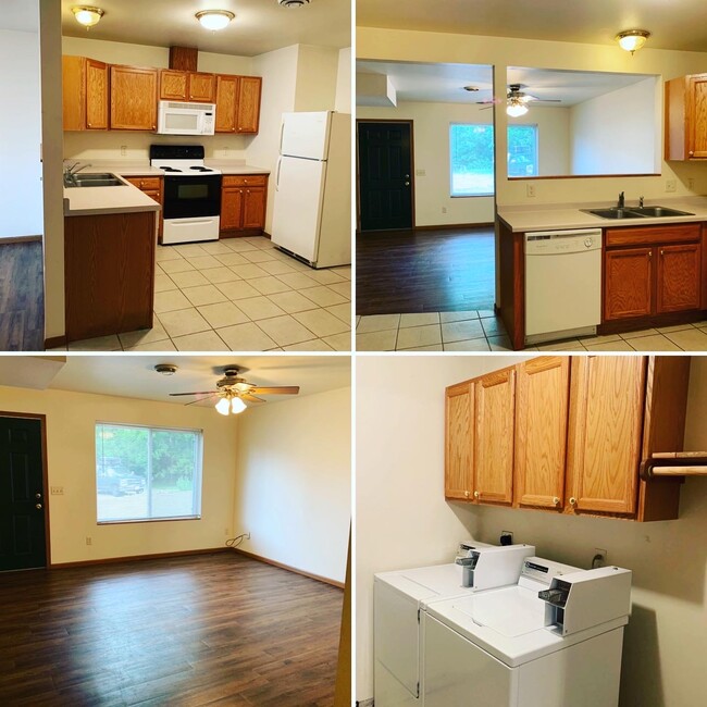 Main level includes living room, kitchen with dishwasher, microwave, laundry room, 1 of the 4 bedrooms and 1 of the 2 baths. - 410 3rd St W