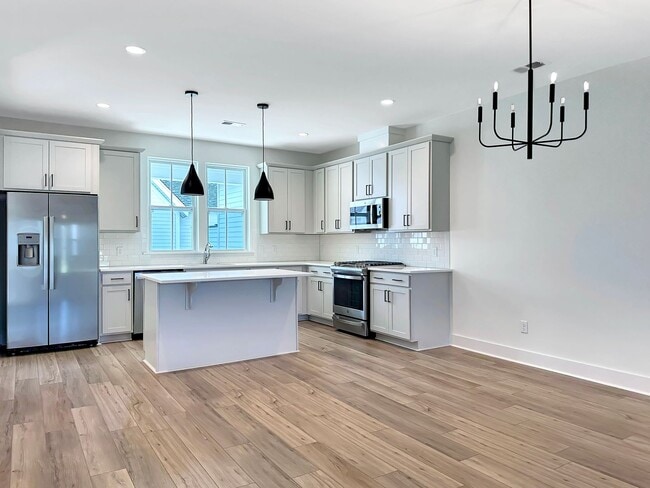 Building Photo - Beautiful, 3-Bedroom Midtown Nexton Townhome with Garage & Amenities