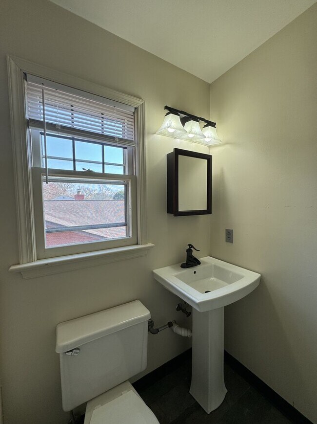 Building Photo - Introducing a charming Colonial style home...