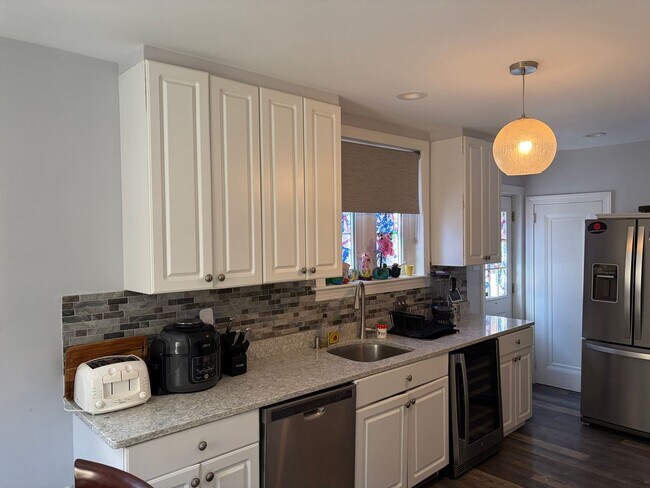 Building Photo - Elegant 3 Story Brick Corner Property Now Available