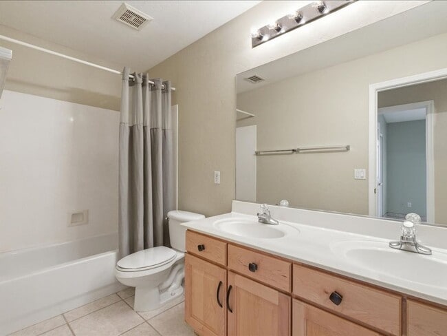 Building Photo - Spacious Living in a Gated Community with Amenities!